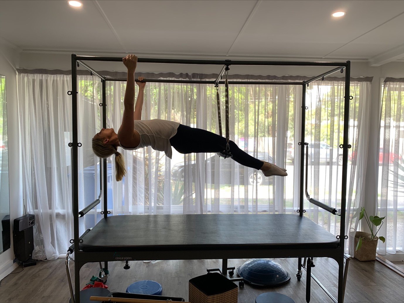 A clinical Pilates session on the trapeze table in our studio
